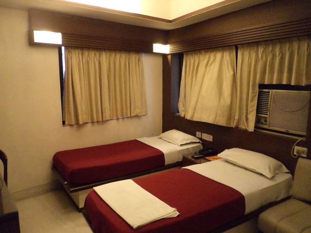 Hotel Aston Колката Номер фото